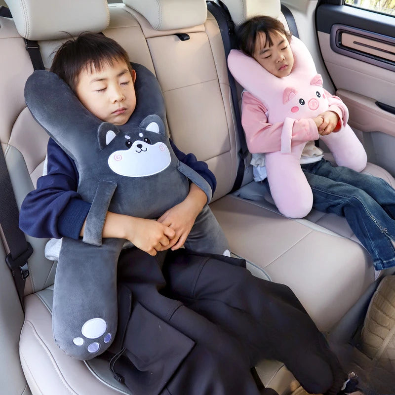 Child sleeping comfortably with car neck pillow on a long drive